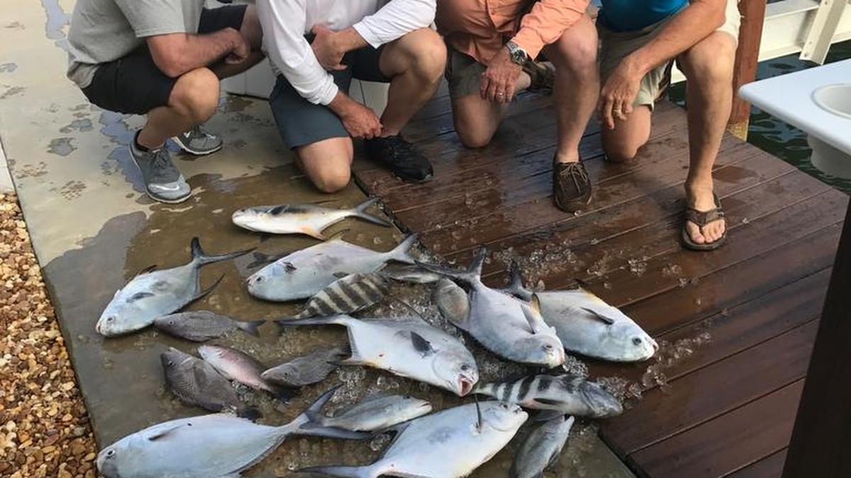 Anglers fishing with Capt. Justin Moore in recent weeks have caught a variety of fish, including hogfish, redfish, pompano and sheepshead, as this group did.