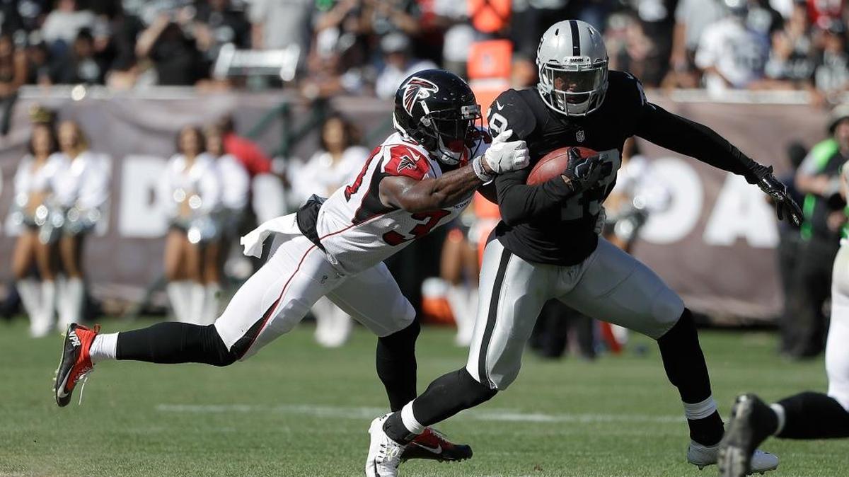 Oakland Raiders running back Jamize Olawale (49) runs against Atlanta Falcons defensive back Brian Poole, left, during the second half of an NFL football game in Oakland, Calif., on Sept. 18.