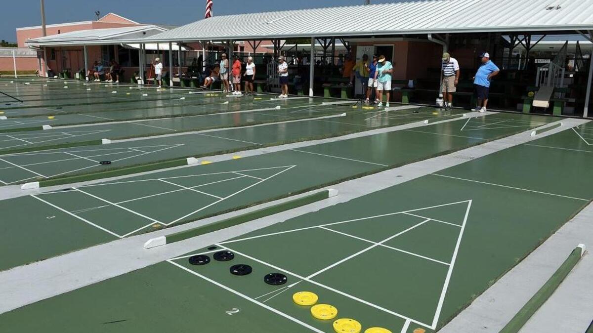 Shuffleboarders compete in a tournament at Trailer Estates during the 2016-17 season.