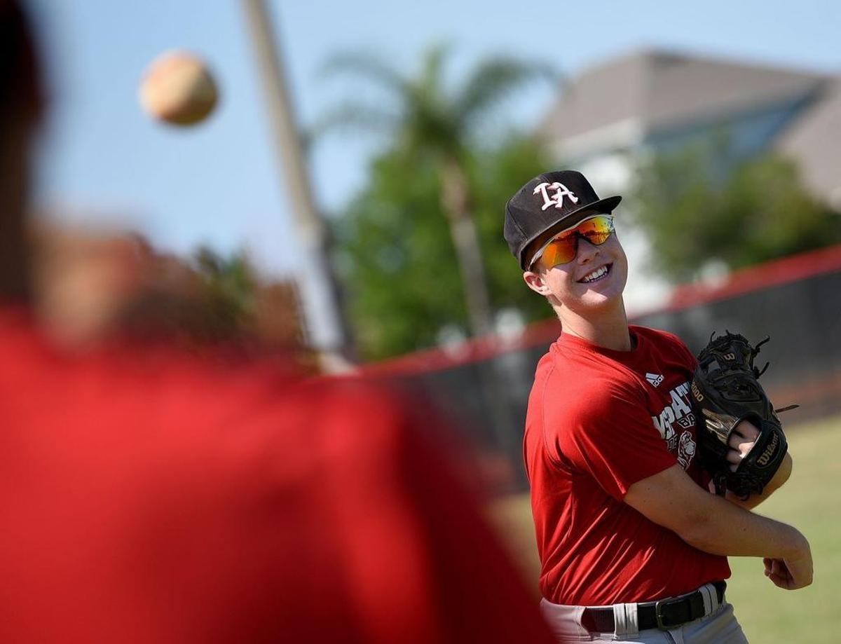 Aaron McDaniel practices with his teammates at Inspiration Academy. McDaniel has overcome the loss of depth perception in his left eye to land a college baseball scholarship.