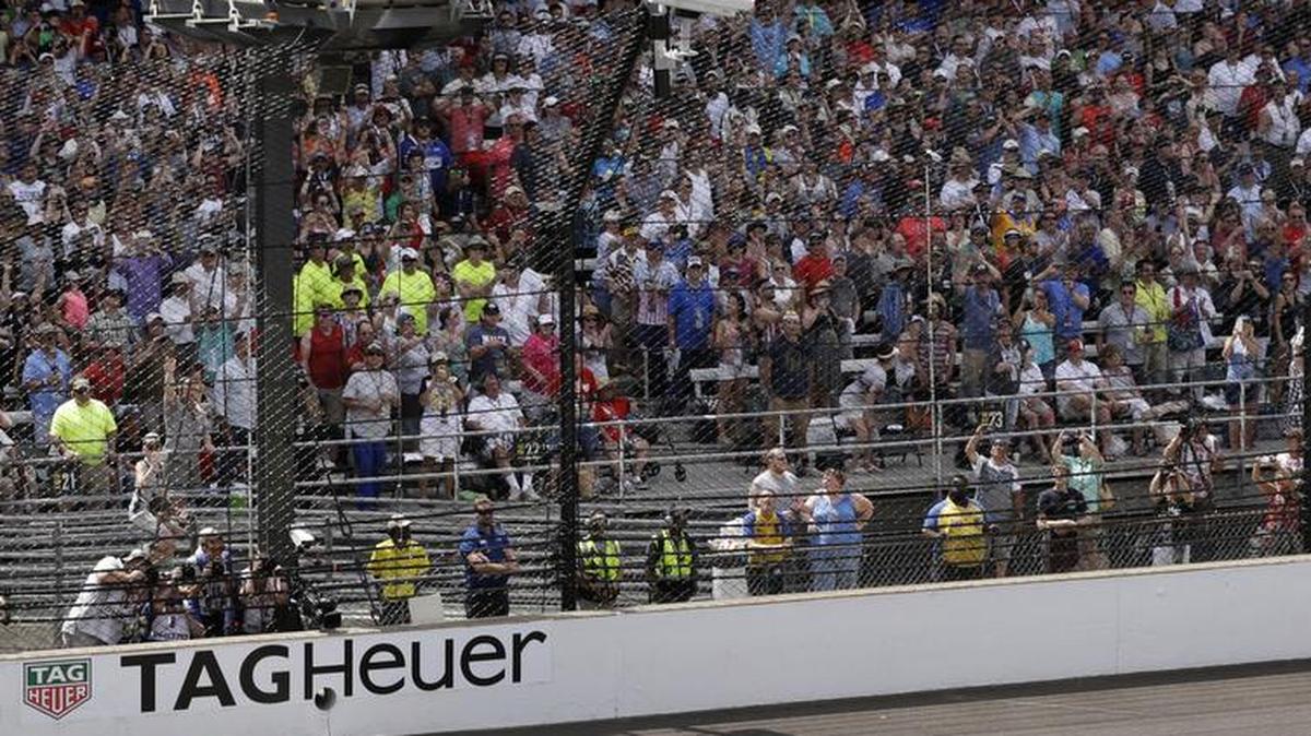 Alexander Rossi takes the checkered flag to win the 100th running of the Indianapolis 500 at Indianapolis Motor Speedway in Indianapolis, Sunday.