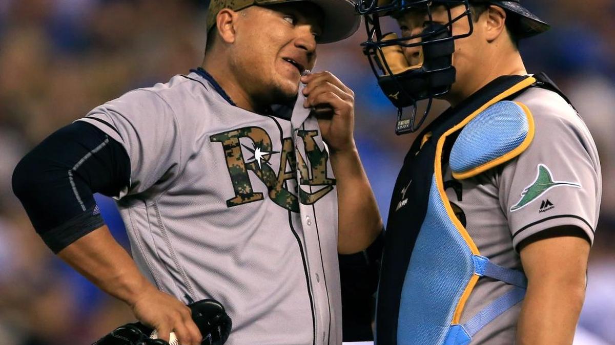 Tampa Bay Rays relief pitcher Erasmo Ramirez, left, talks with catcher Hank Conger, right, during the eighth inning of a baseball game against the Kansas City Royals at Kauffman Stadium in Kansas City, Mo., Monday.