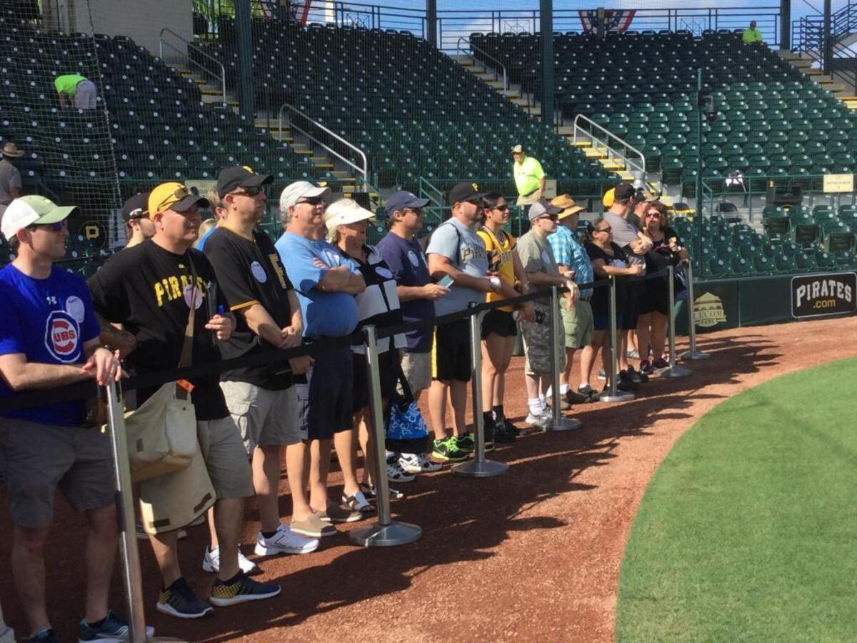 Fans watch batting practice in a roped off area just on the field at LECOM Park on Saturday. The Pittsburgh Pirates played the New York Yankees to open their 50th spring at Bradenton’s LECOM Park.
