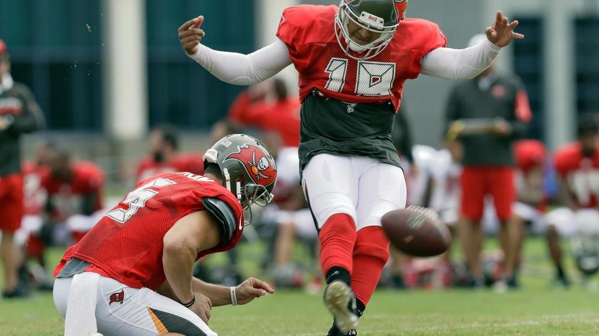 Tampa Bay’s Roberto Aguayo kicks a field goal as punter Jacob Schum holds during a training camp practice Tuesday in Tampa. Aguayo was a Buccaneers second round pick in the 2016 draft.