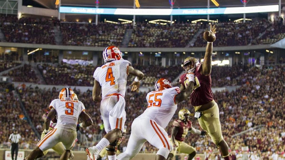 Florida State defensive lineman Demarcus Christmas breaks up a pass by Clemson's Deshaun Watson during the second half in Tallahassee on Oct. 29.