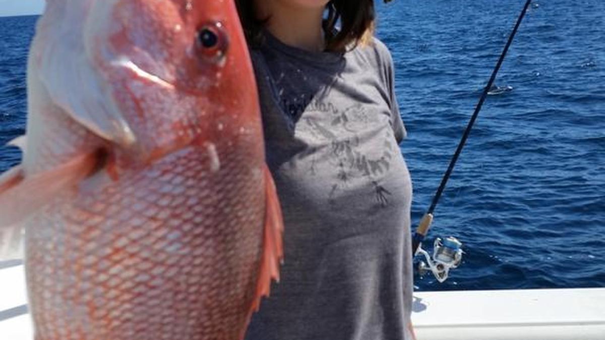Sarah Szymanski Horn shows off a red snapper caught recently while fishing in approximately 55 feet of water in the Gulf of Mexico off Bradenton.