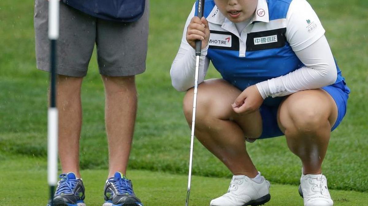 China’s Shanshan Feng lines up a putt on the second green during the second round of the U.S. Women’s Open on Friday in Bedminster, N.J.