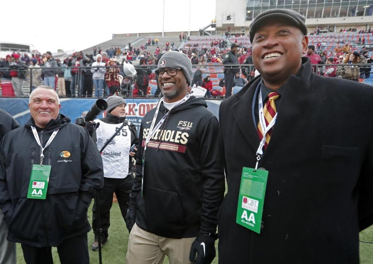 Florida State head coach Willie Taggart, center, a Palmetto native and Manatee High alumnus, drove FSU’s recruiting class from No. 65 to No. 11 in the nation.