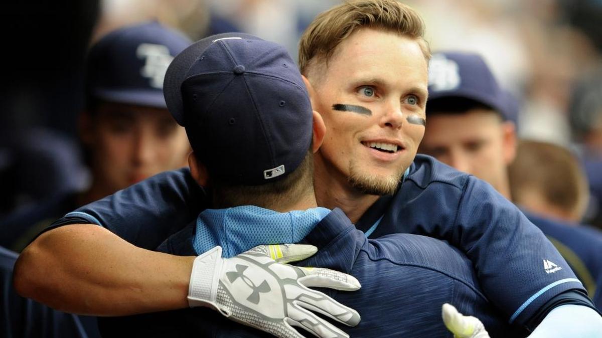 Tampa Bay Rays teammates greet Brandon Guyer in the dugout after his solo home run off Boston Red Sox starter David Price in the second inning Wednesday.