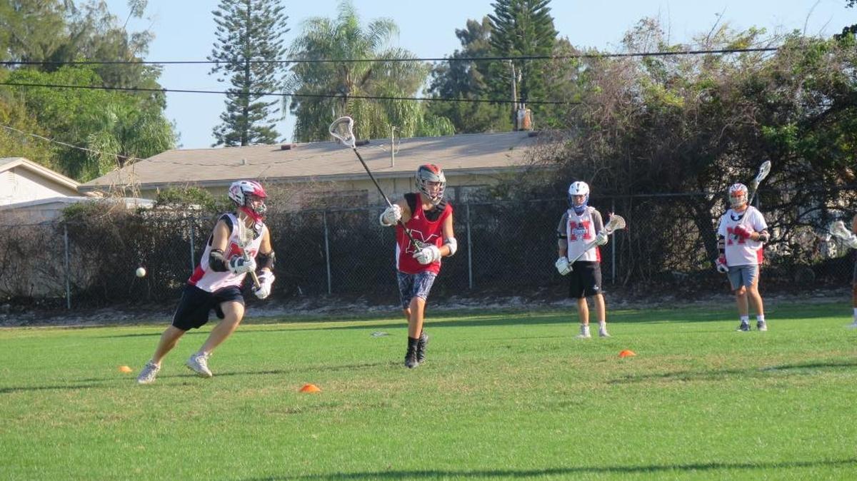 Quin Rice (left) races by a defender during a drill at a Manatee Express practice at Palma Sola Park.