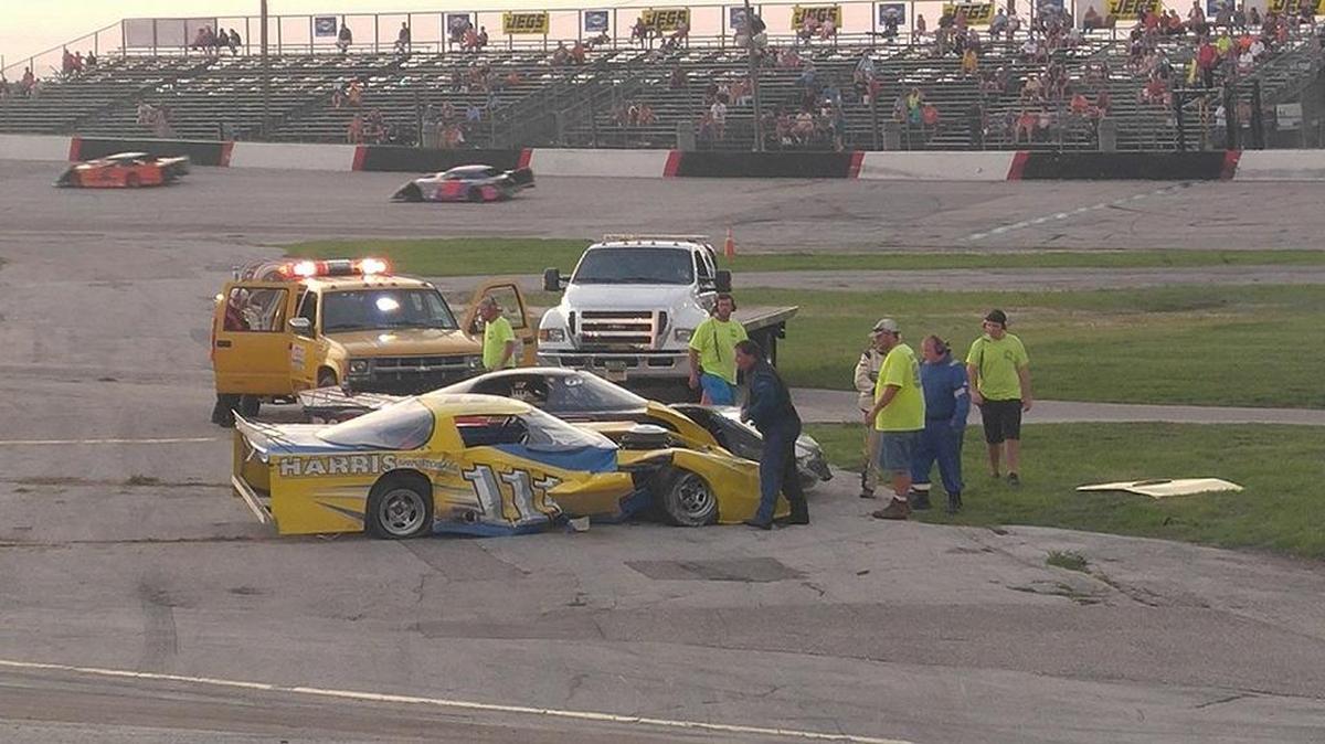 Track emergency personnel attend to a wreck during Saturday’s race card at Desoto Speedway on July 9.