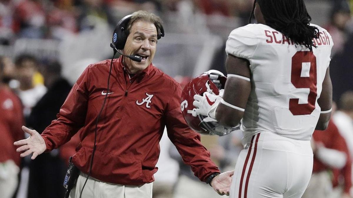 Alabama head coach Nick Saban talks to Bo Scarbrough (right) during the first half of the NCAA college football playoff championship game against Georgia Monday, Jan. 8, 2018, in Atlanta. Scarbrough is alleged on video prior to Monday’s game to have said, “F--- Trump.” Scarbrough denied saying it following the Crimson Tide’s fifth national title in the last nine years.