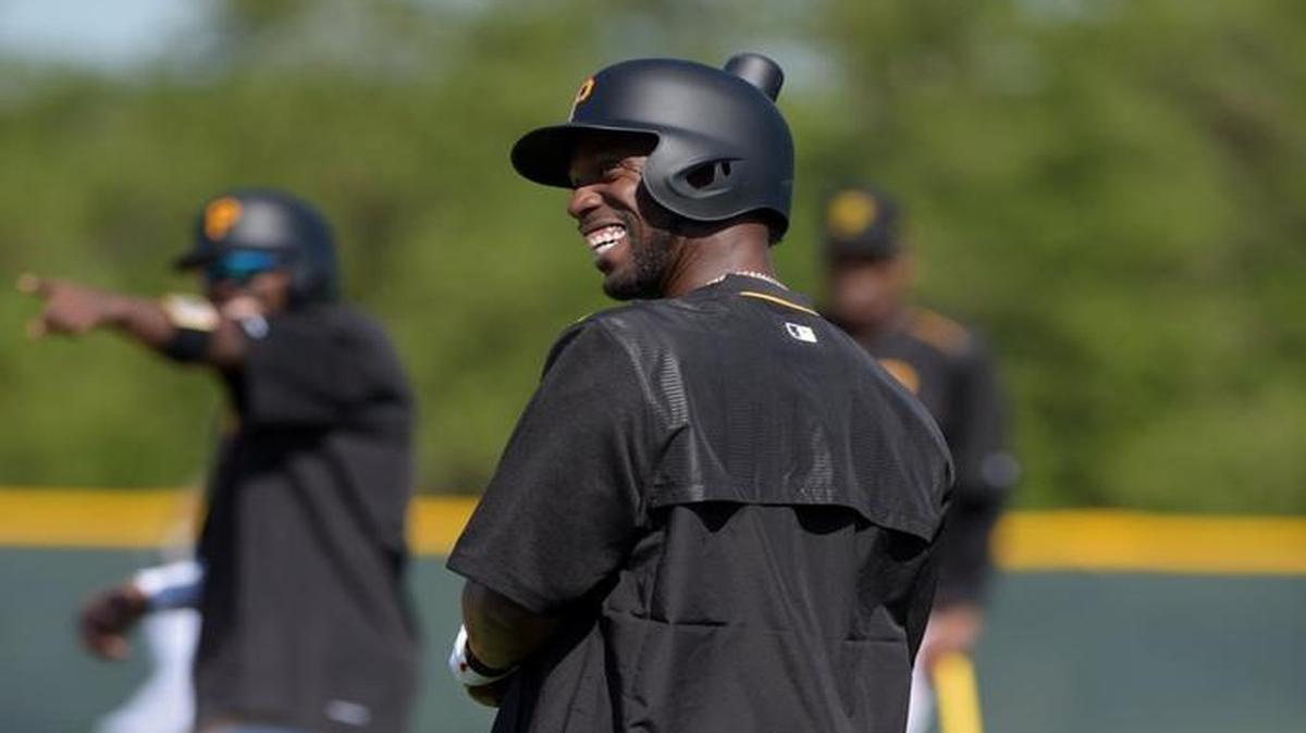 Pirates outfielder Andrew McCutcheon laughs at batting practice during the first day of positional players' practice at Pirate City Friday.