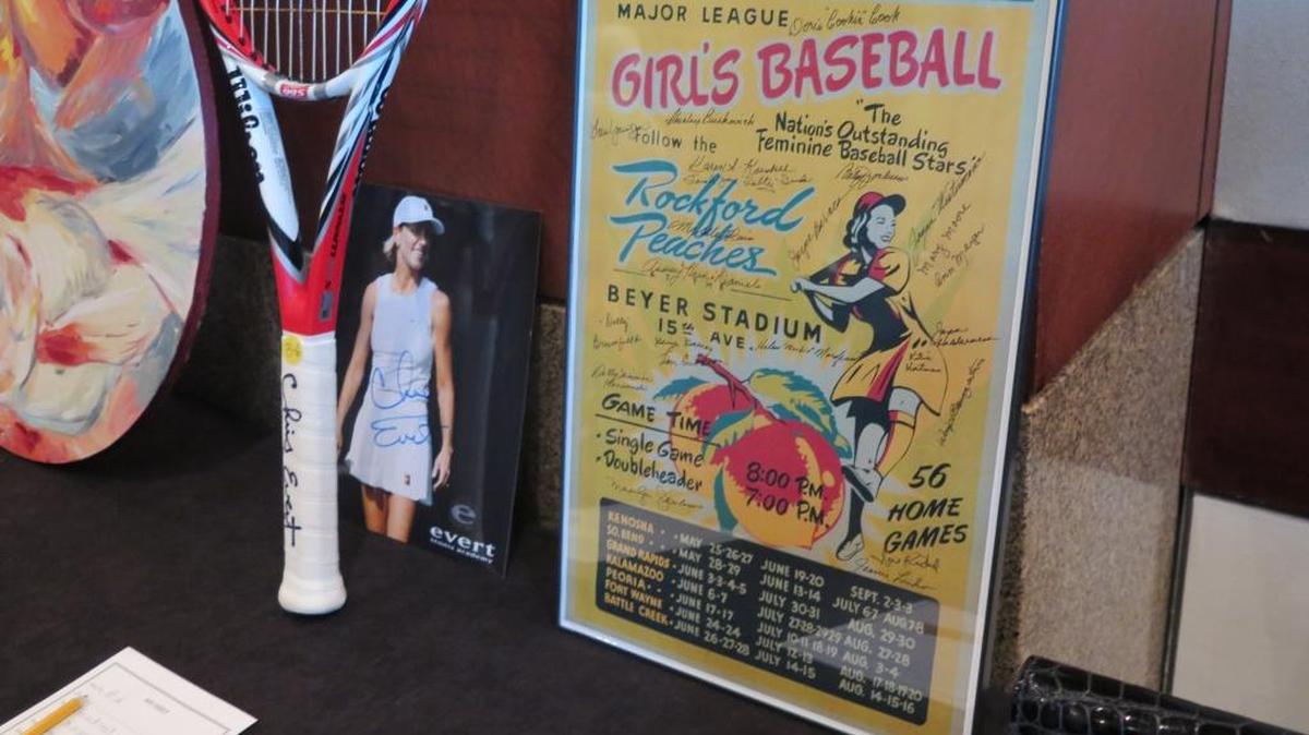 A program signed by All-American Girls Professional Baseball League alumni and a tennis racket signed by Chris Evert are auctioned at the Women’s Sports Museum Kick-Off Gala on Saturday in Sarasota.