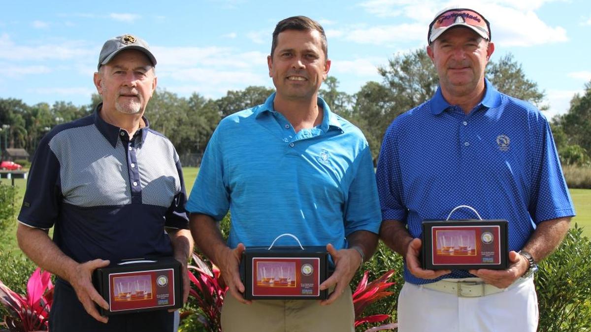 Bradenton’s Jim Stone (left) is joined by Lakeland’s Wayne Raath (center) and Tarpon Springs’ Neil Vanleeuwen (right) as divisional champions at the Florida State Golf Association's Winter Series event at the Country Club of Winter Haven on Monday.