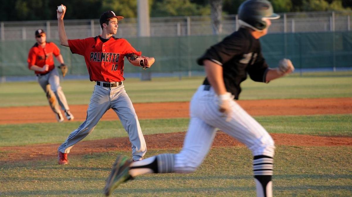 Palmetto’s Jacob Josey throws to first as Lakewood Ranch’s Colton Chupp tries to beat the throw during a game last season. The junior pitcher/shortstop is one of the leaders on the Tigers.