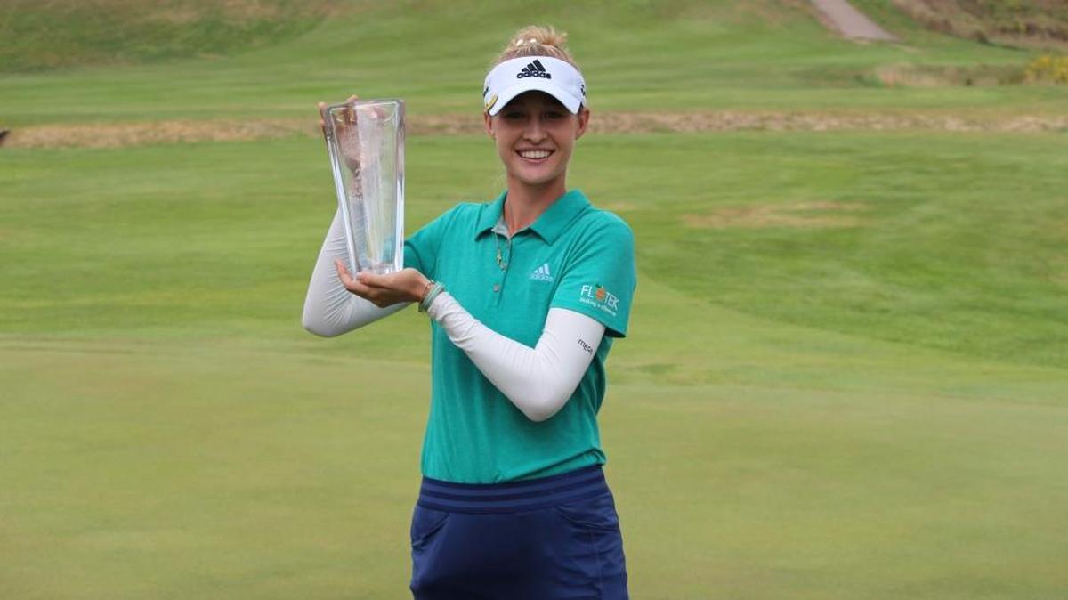 Nelly Korda, of Bradenton, holds the winner’s trophy for the Sioux City GreatLife Challenge on Sunday, Sept. 4, 2016. The 18-year-old earned her first professional title and $31,500, the second largest winner’s prize on the Symetra Tour.