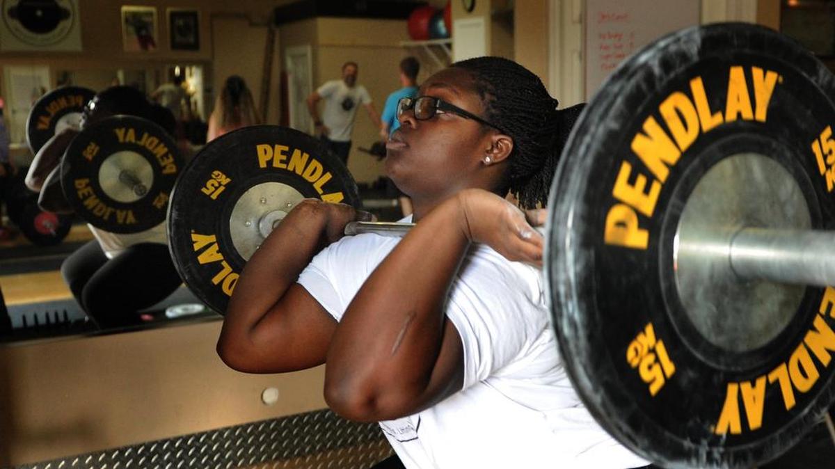 Sha’la McMillan, a record-setting youth lifter, practices during a training session at City Fitness in Bradenton earlier this year.
